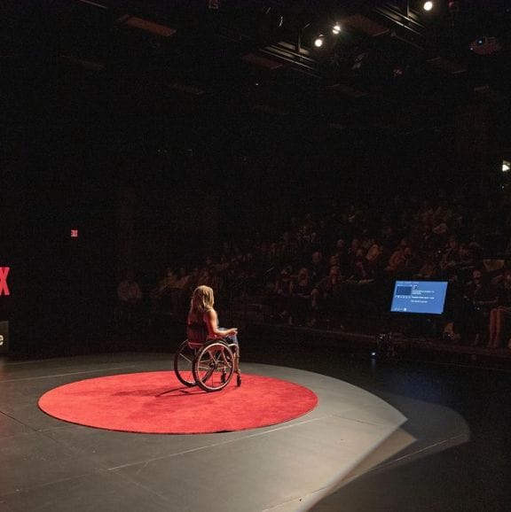 picture taken from behind alycia delivering her tedx south lake tahoe speech to the crowd