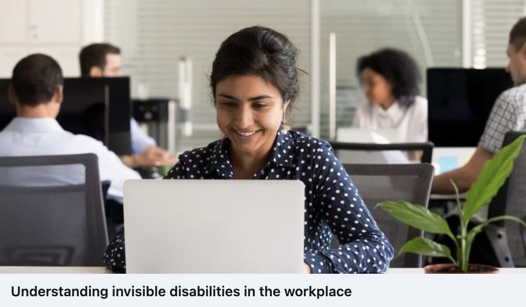 lady smiling at her laptop with caption understanding invisible disabilities in the workplace