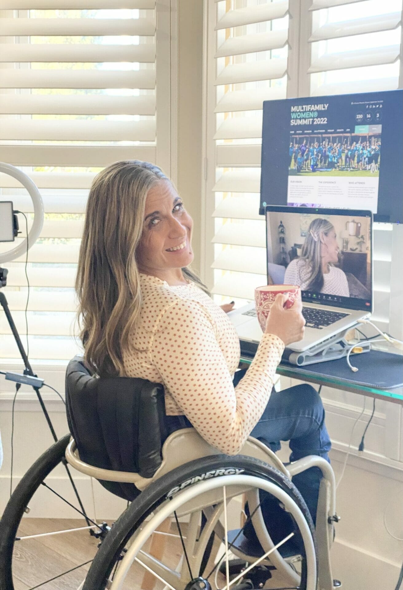 alycia looking over her shoulder smiling after delivering the podcast with multifamily women