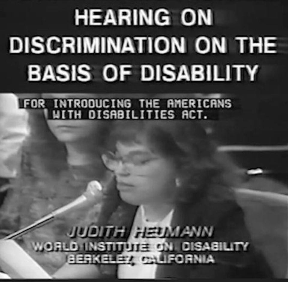 judy heumann in black and whiet speaking to congress on hearing on discrimination on the basis of disability