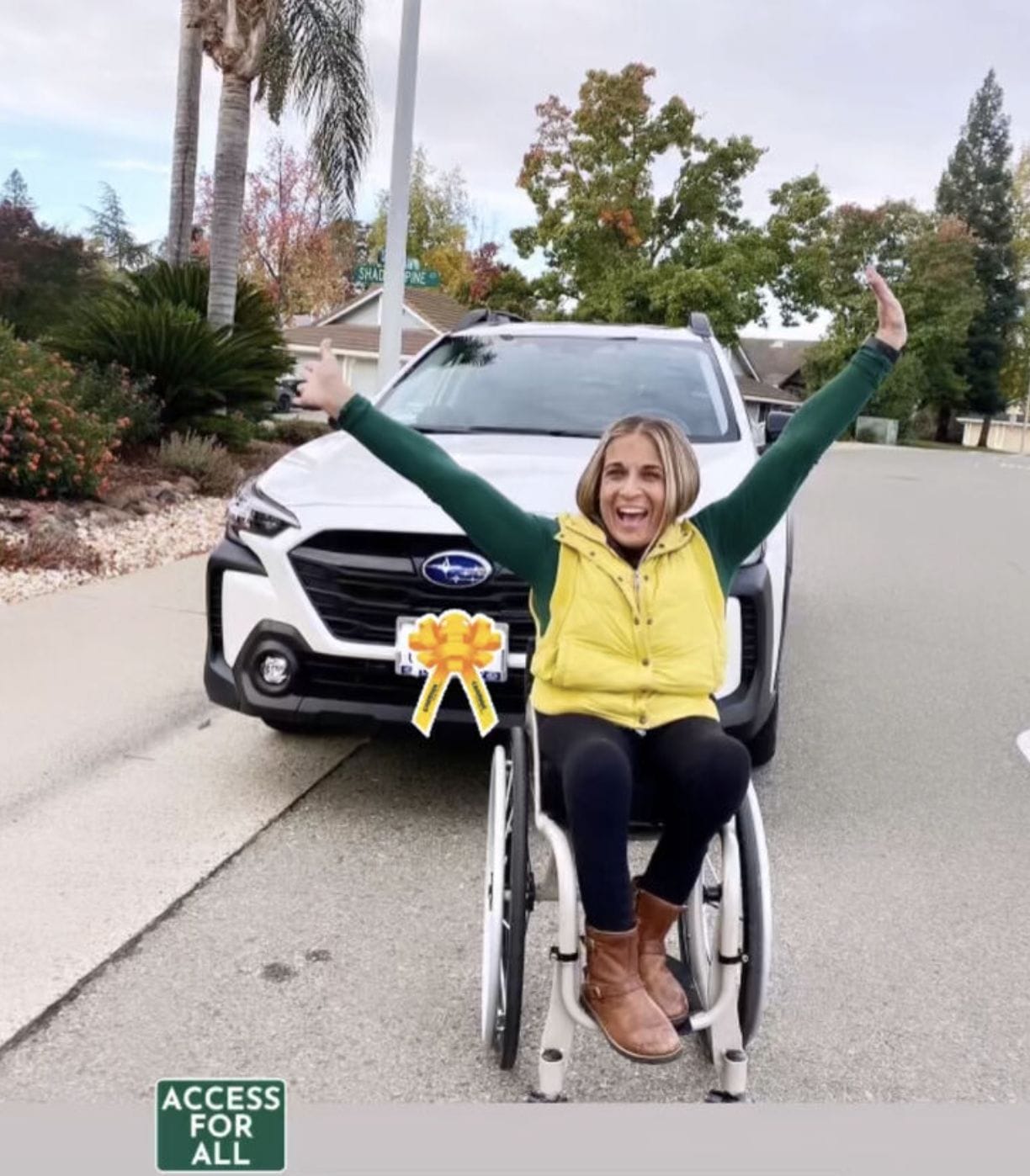 alycia waiving her hands in the air in front of her new subarau