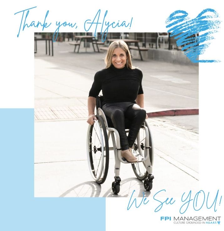 ID: Alycia wearing all back sitting in wheelchair crossing the street smiling with a keynote thank you, Alycia from FPI Management.