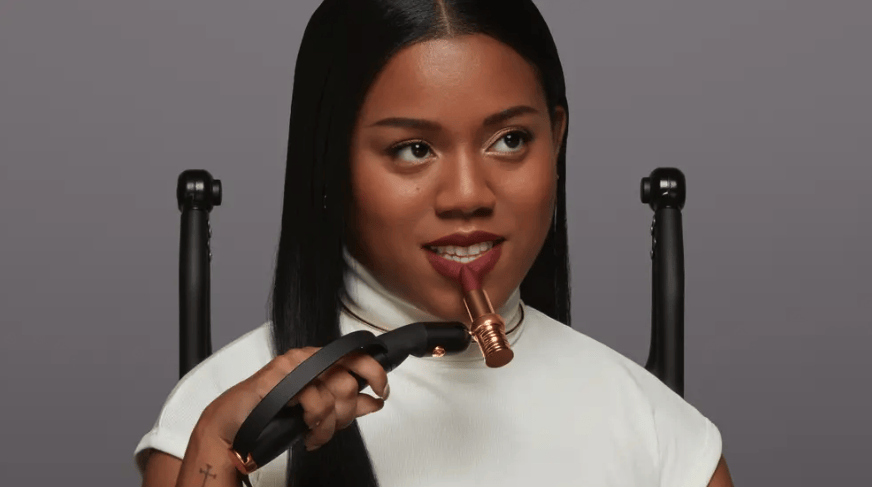Article cover of L'Oréal made a handheld, motorized device that helps people with disabilities apply lipstick. It's meant to give users independence. Women with a disability applying red lipstick using handheld, motorized devices that help people with disabilities apply lipstick.