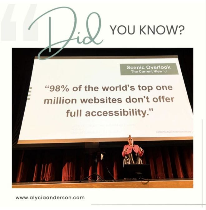 ID:Alycia on wheelchair on stage wearing a red jacket in front of a website accessibility stat from https://lnkd.in/geHS8eBA that says "98% of the world's top websites don't offer full accessibility."