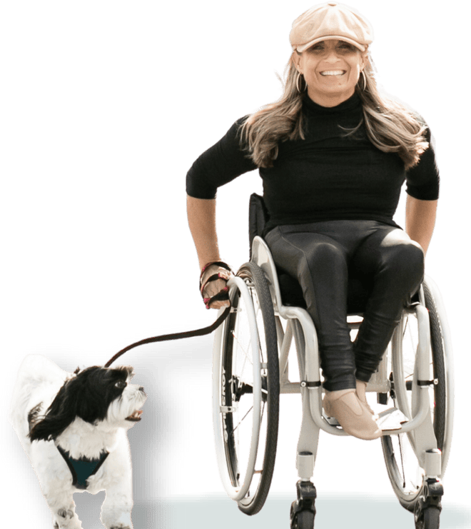 alycia pushing her wheelchair with her dog
