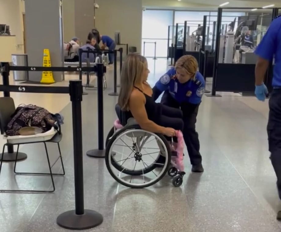 Alycia Anderson getting a full body search from TSA agent
