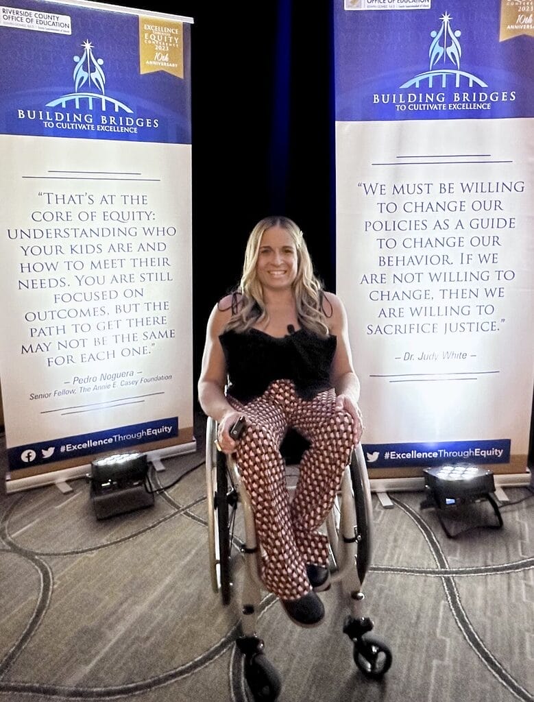 alycia in front of rcoe conference marketing banners