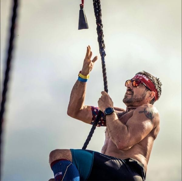 nick klingensmith climbing a rope obstacle