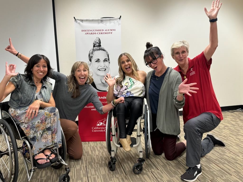 alycia celebrating with kerri carli josie and doctor lytle in front of a banner of alycia