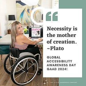 Alycia sitting in her wheelchair looking behind at her desk near a computer.