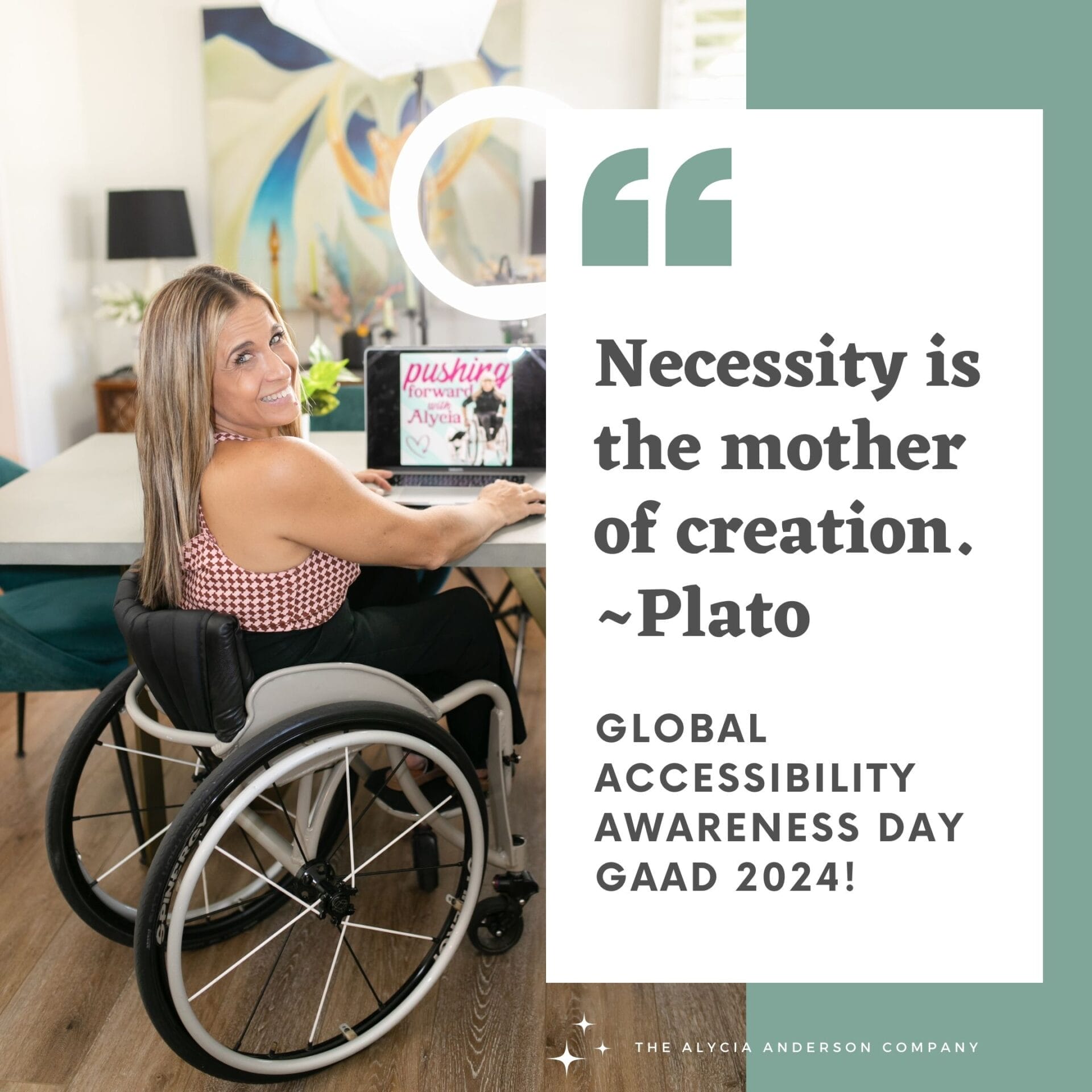 Alycia sitting in her wheelchair looking behind at her desk near a computer.