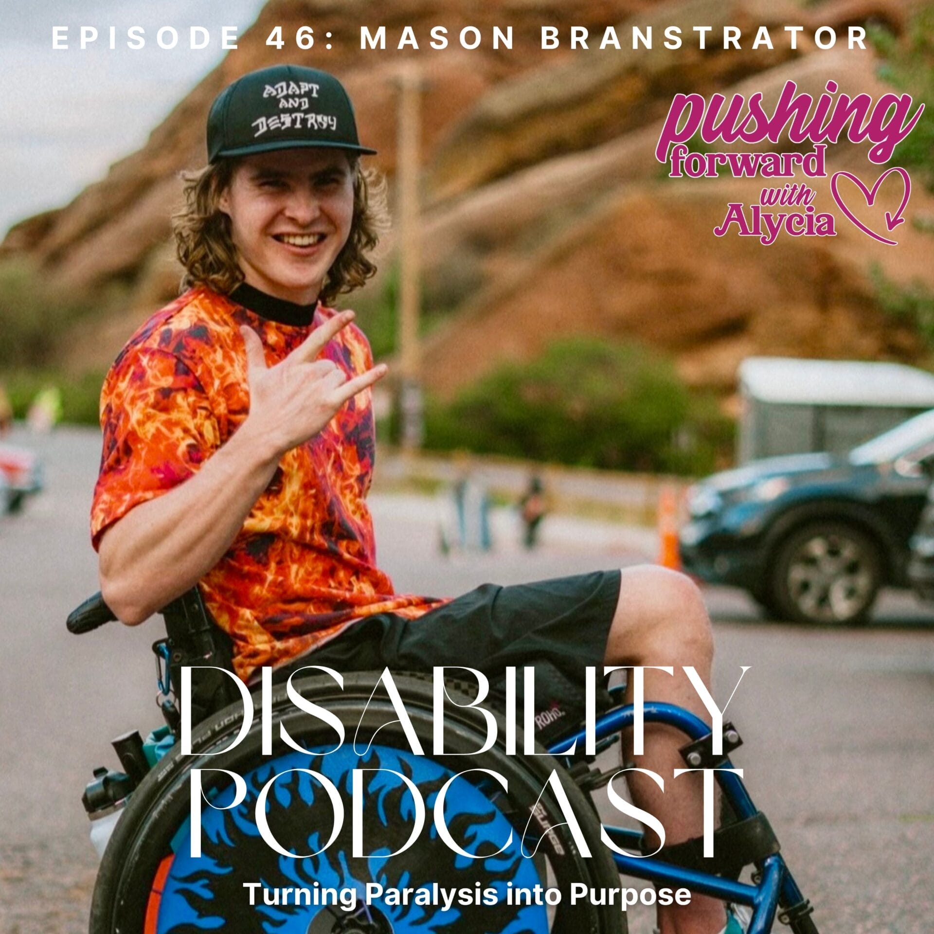 mason branstrator sitting in the sand in his wheelchair giving the i love you hand sign on his turning paralysis into purpose episode forty six of pushing forward with alycia
