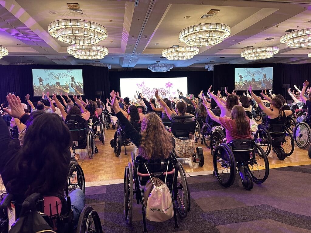 girls dancing in their wheelchairs at a group dance at rollettes experience