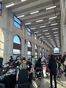 a glimpse of all the models getting ready in their wing of the studio before the show