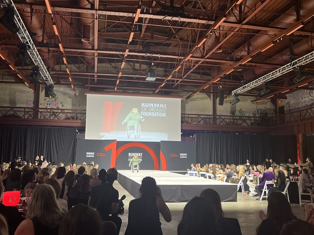 alycia on the runway during the live event at the runway of dreams