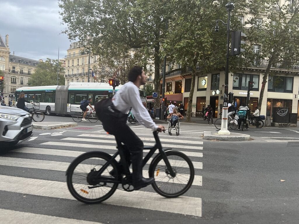 alycia crossing the street in a crosswalk in paris