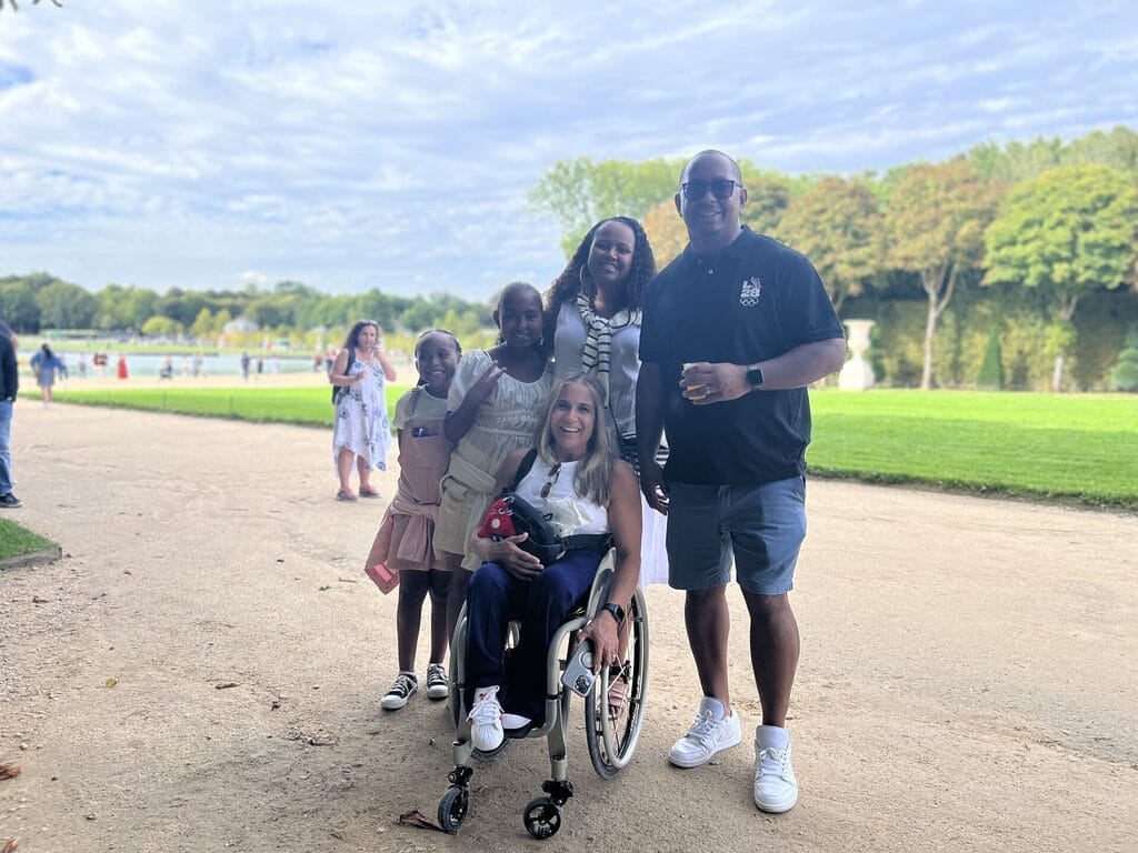 alycia with the mayor of long beach california rex richardson and his family in the gardens of versailles