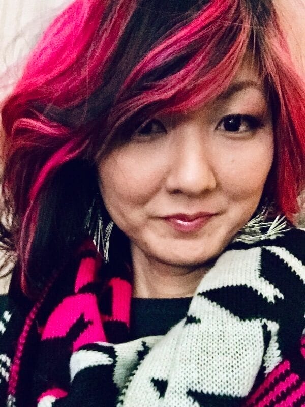 kam redlawsk smiling with pink and black hair