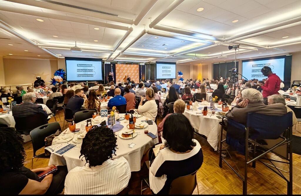 alycia on stage at the arc caddo bossier leadership luncheon on l s u s campus