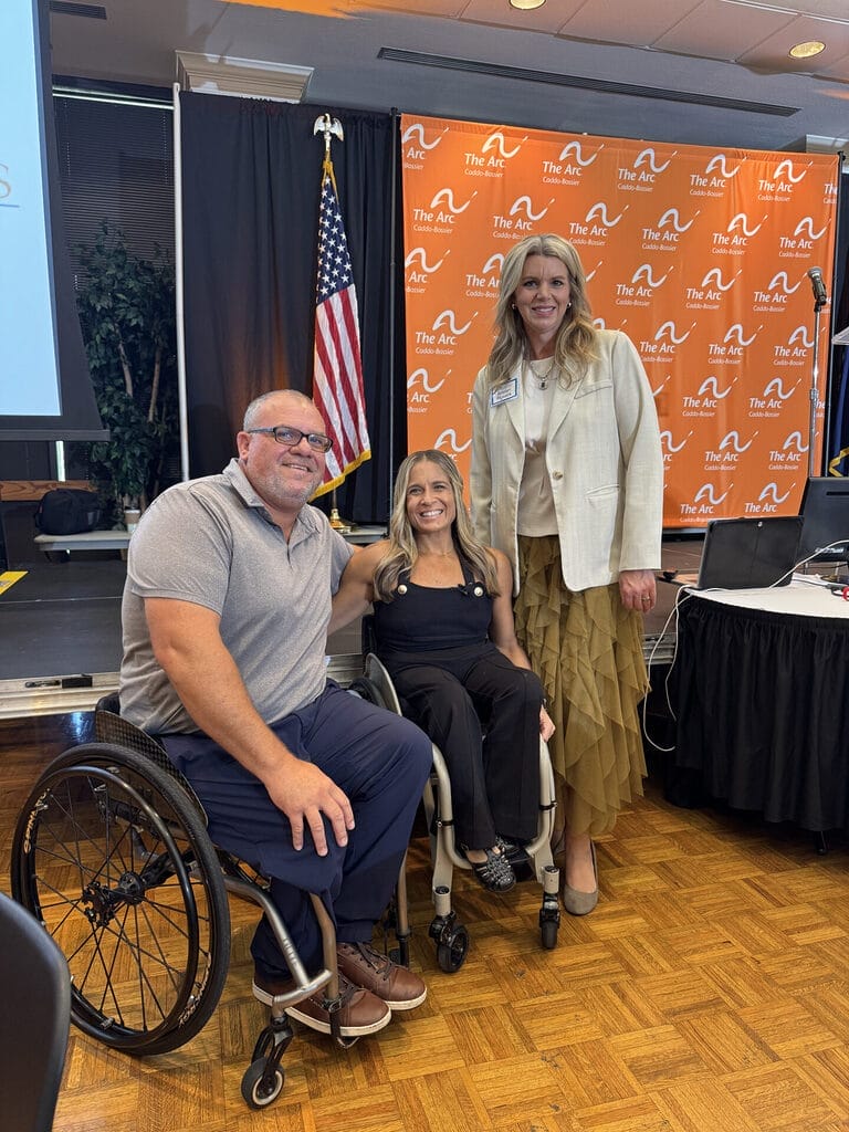 alycia posing for a picture with marty and kristen powers