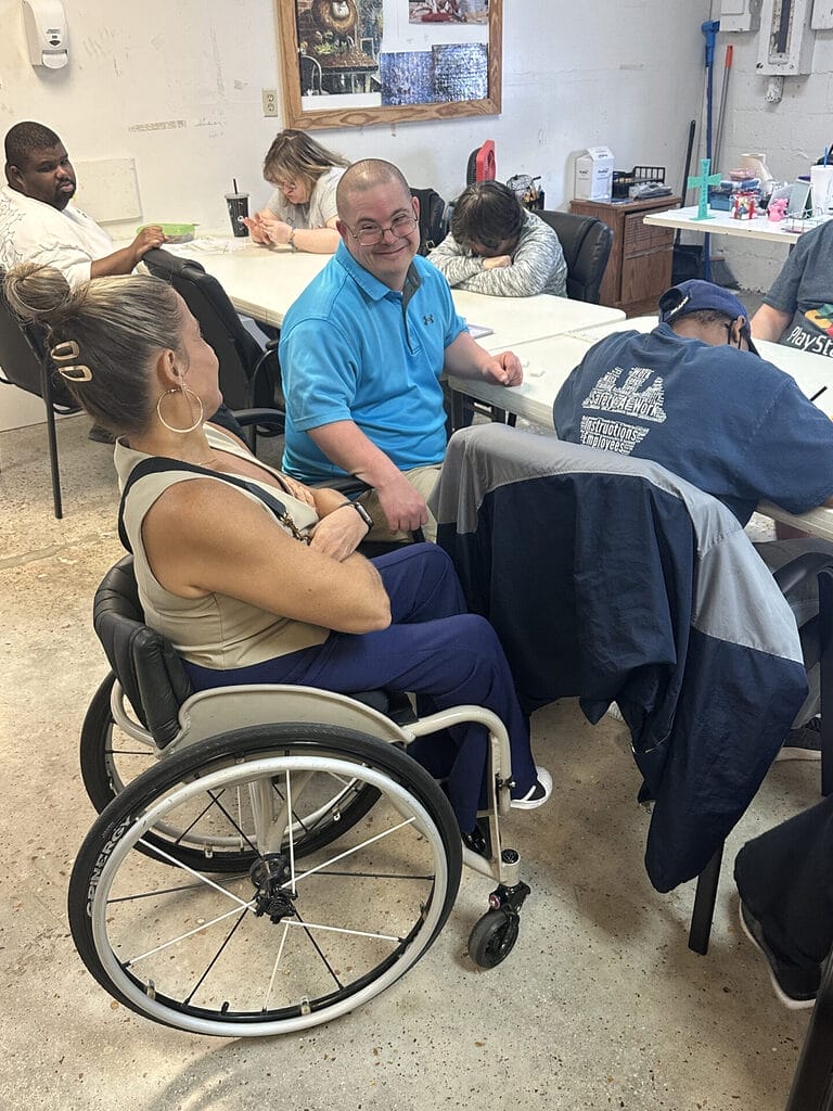 alycia with participants of frost industries day programs