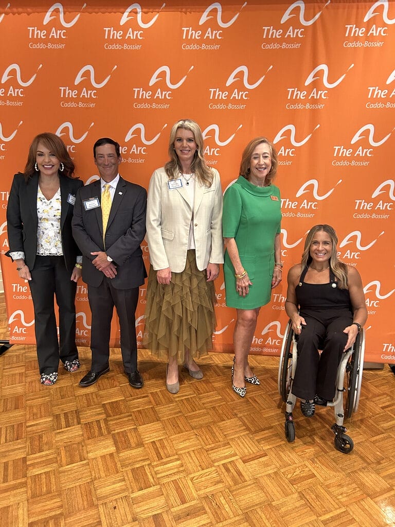 alycia posing for a picture with jacque jovic kevin pesnell kristen powers and another noard member of the arc caddo bossier