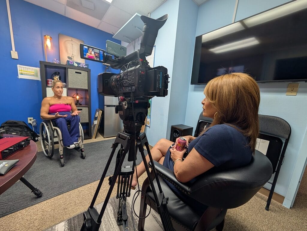 alycia anderson being interviewed by jacque jovic in an office with camera equipment