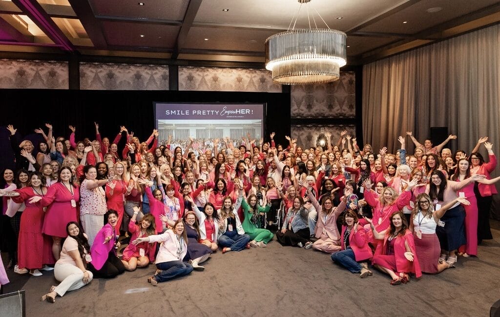 200 EmpowerHer attendees taking a group photo
