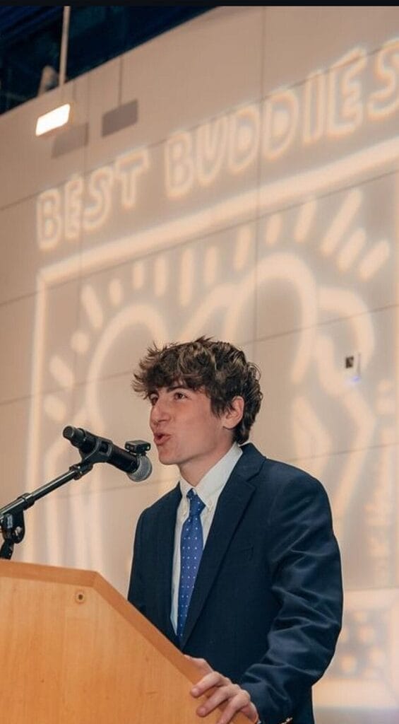 shane walsh speaking at a best buddies event