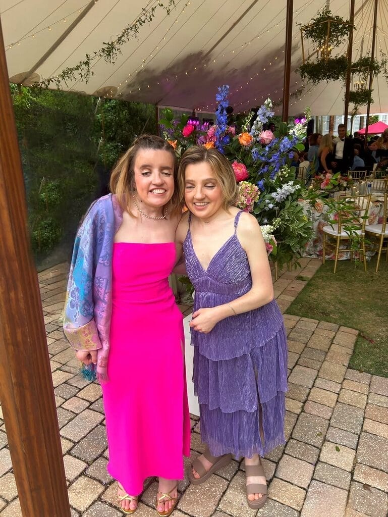 m e and wesley standing next to each other wearing summer dresses