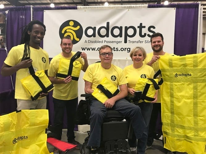 adapts team at a trade conference displaying the product in front of their booth