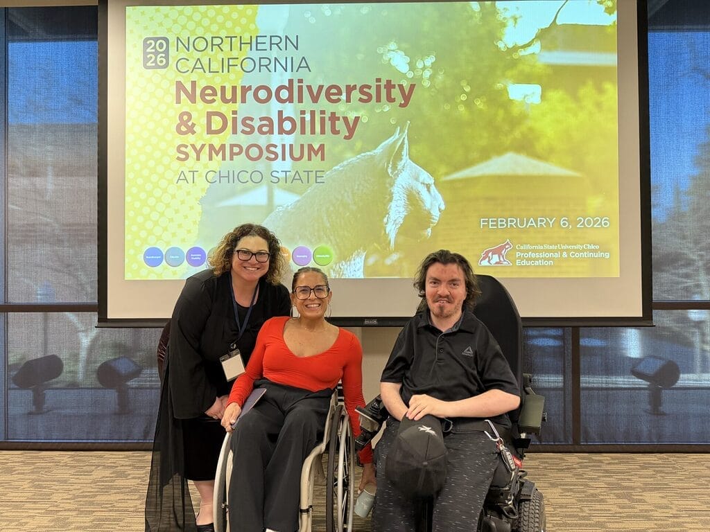 Alycia with two students speaking on stage on a panel at Chico State Neurodiversity Summit