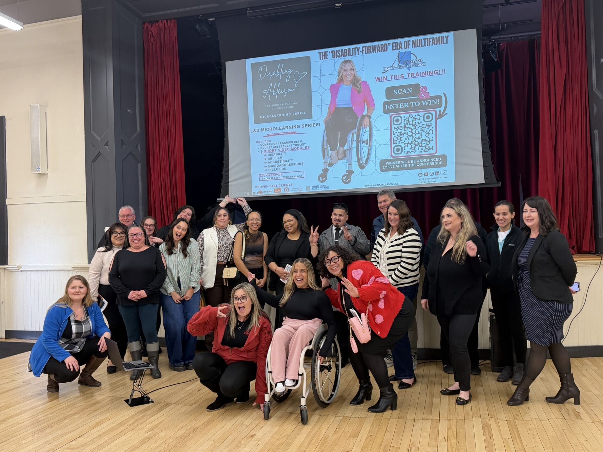 Alycia with larget group after keynote event on disability inclusion in housing