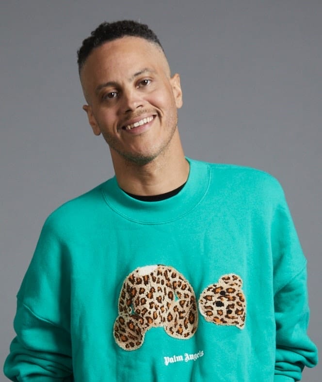 headshot of james ian smiling wearing a sweatshirt