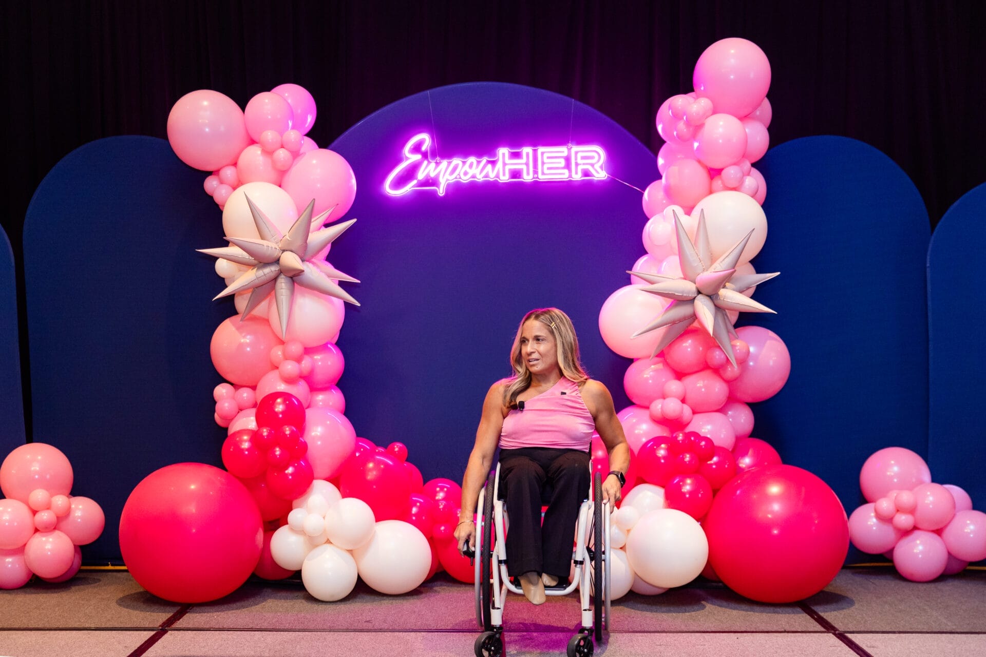 alycia on stage at the empowher event for womens history month