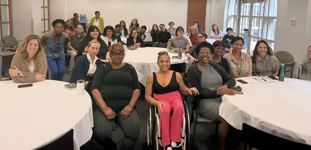 alycia posing for a group shot with the attendees of her talk at tulane law school