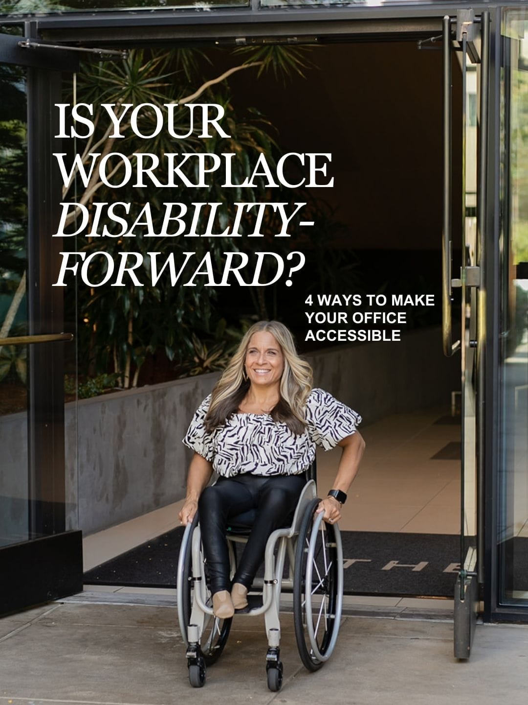 Image description: Alycia, a blonde woman and wheelchair user, confidently rolls through a modern glass doorway, wearing a sleek black outfit and heels, embodying strength, professionalism, and leadership.